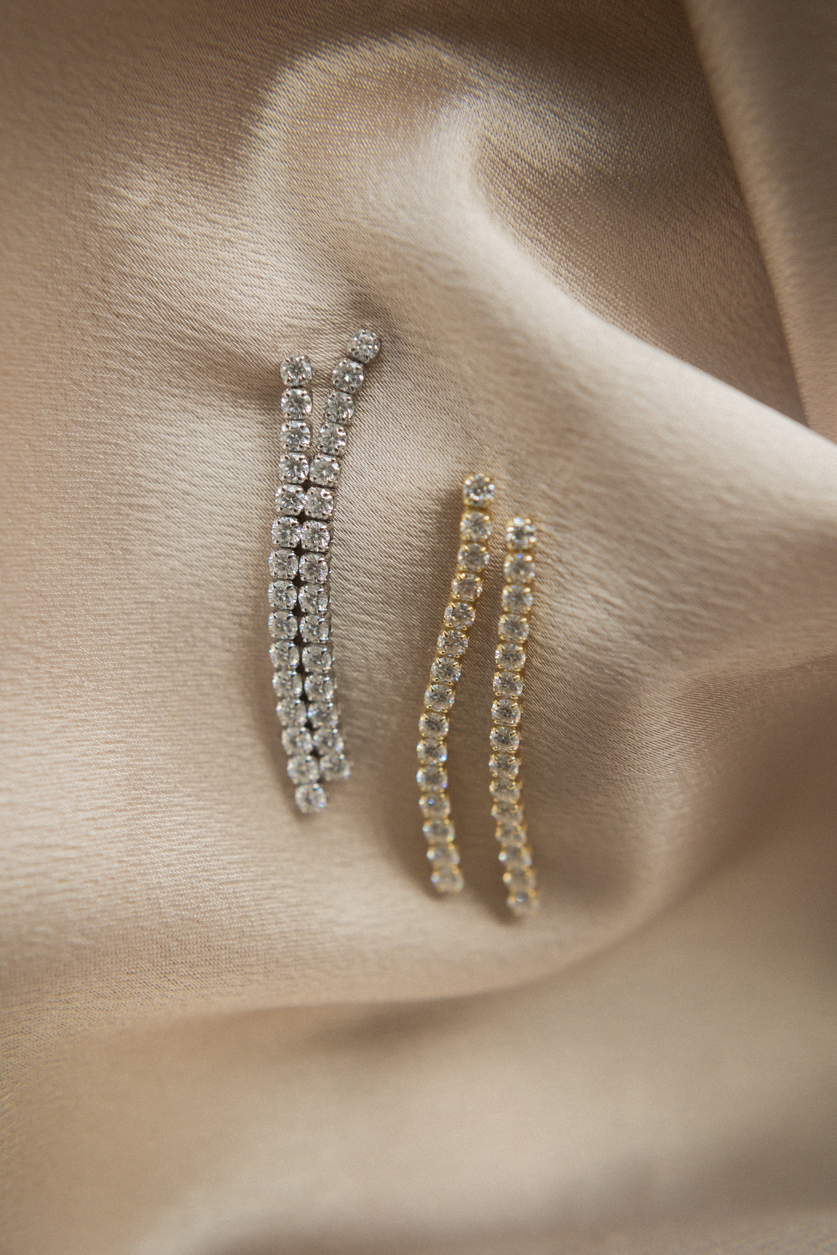 Moissanite demi fine white gold filled post earrings in a tassle like manor. Perfect gift or everyday wear. Sold by Cival in bayview milwaukee wisconsin