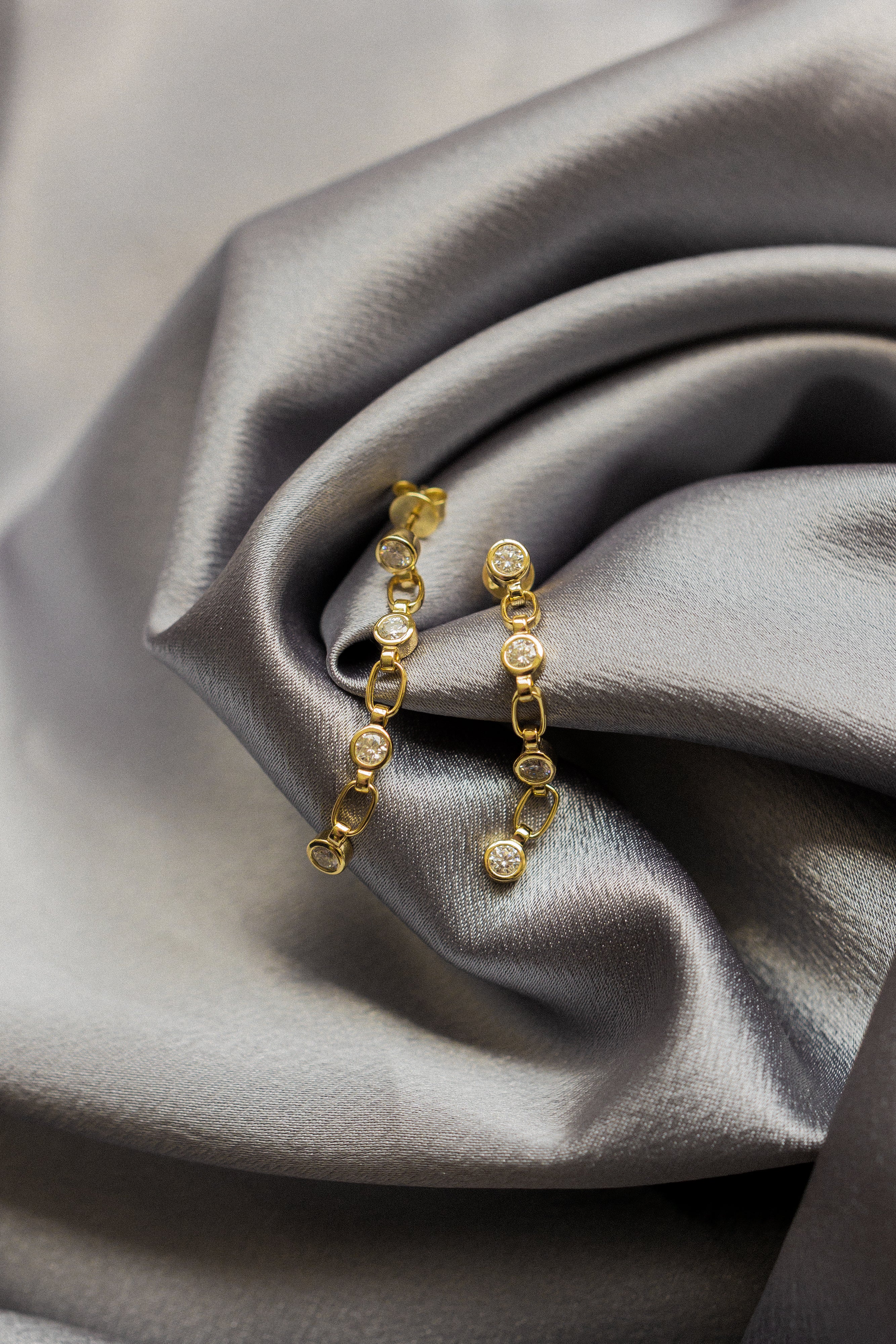 Yellow gold vermeil post earings with paperclip chain and bezel set moissanites. Perfect demi-fine gift or everyday wear. Sold by Cival in Milwaukees Bayview.