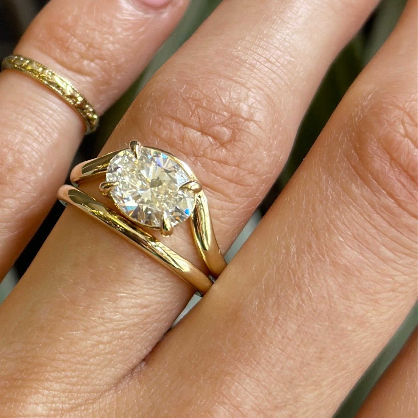 14k yellow gold Oval Diamond Engagement ring with wavy band. Customize this unique ring with your choice of stone type, stone shape and stone size. Diamond, moissanite, round, oval, princess, cushion, asscher, marquise. Cival in Milwaukee Wisconsin.