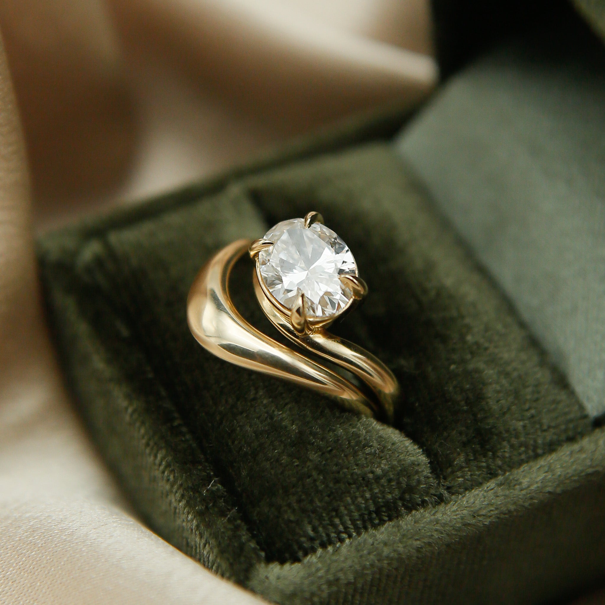 Gold wave ring with east west oval Dimond engagement ring by cival collective - Milwaukee Jewelry company