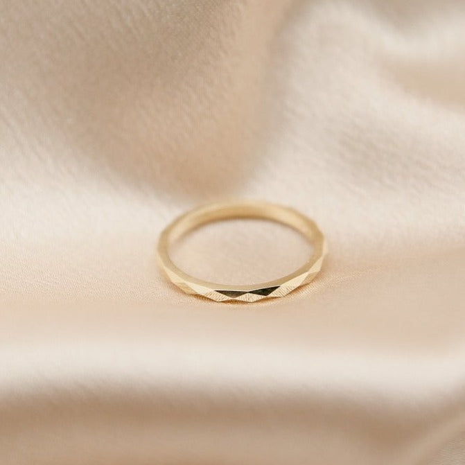 Yellow gold faceted pattern ring by unique Milwaukee Jewelry shop Cival. Fine jewelry designs for anniversary presents, birthday presents or special occasions.