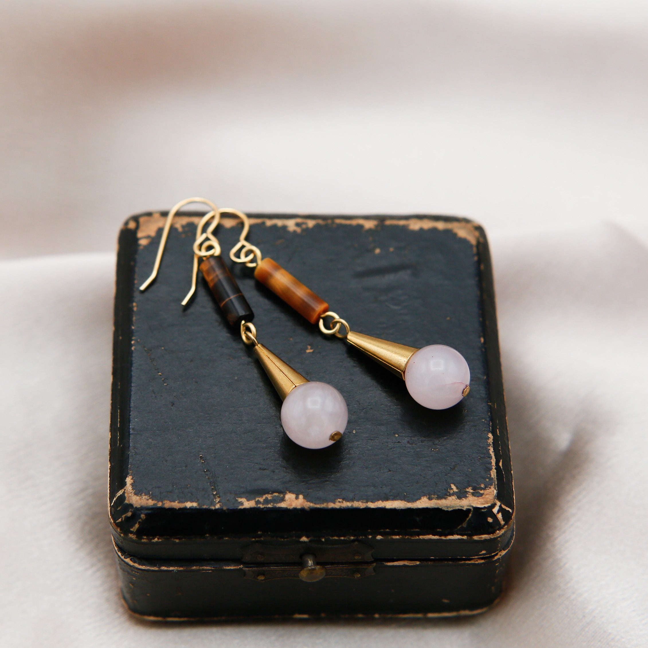 Close up of drop Annie earrings with tigers eye and rose quartz