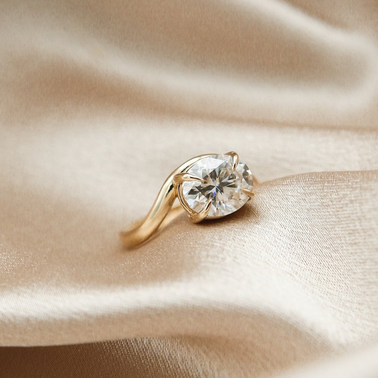 east west oval diamond engagement ring by cival jewelry design company