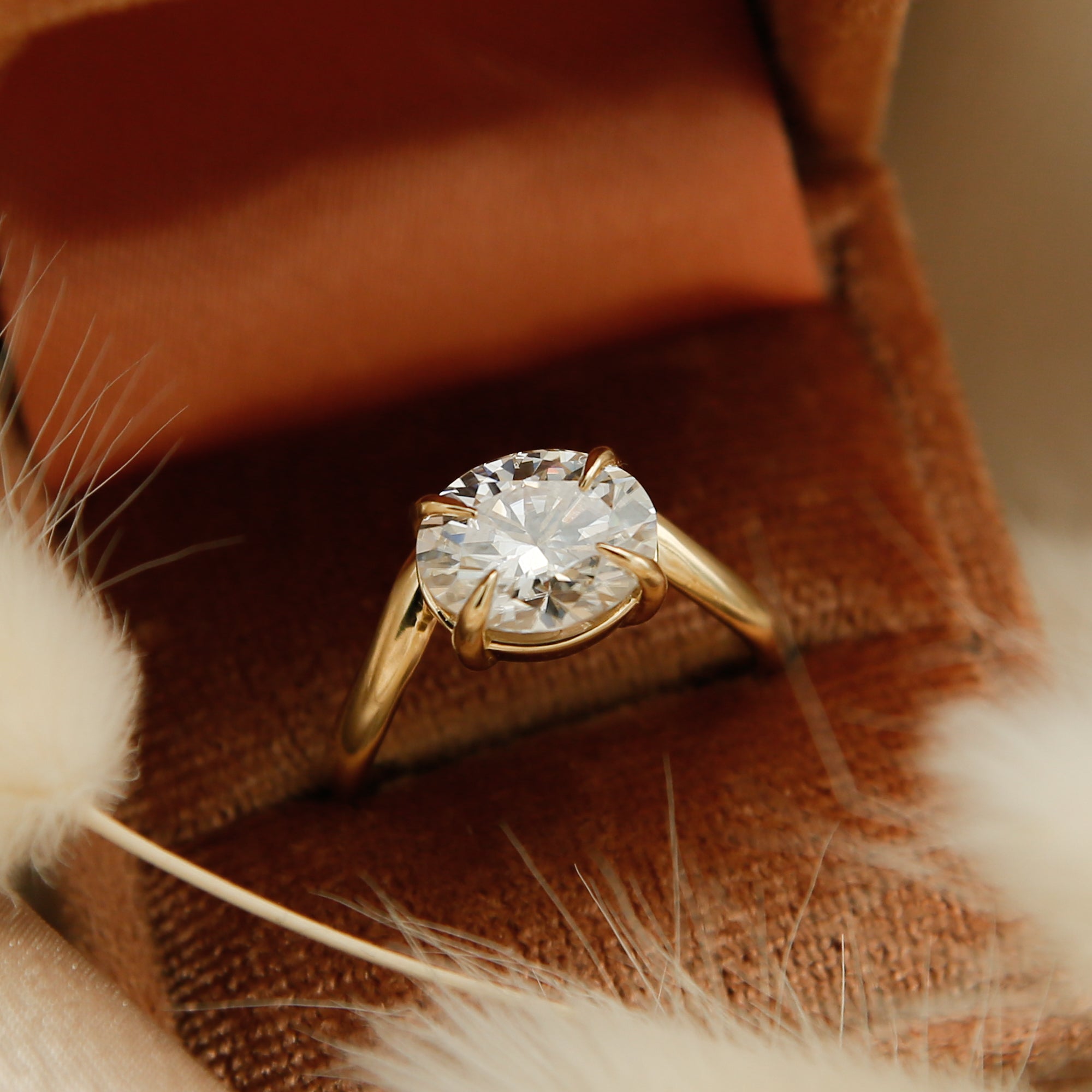 14k yellow gold oval east west diamond wave engagement ring with claw prongs. Customize this unique ring with your choice of stone type, stone shape and stone size. Diamond, moissanite, round, oval, princess, cushion, asscher, marquise. Cival in Milwaukee Wisconsin.