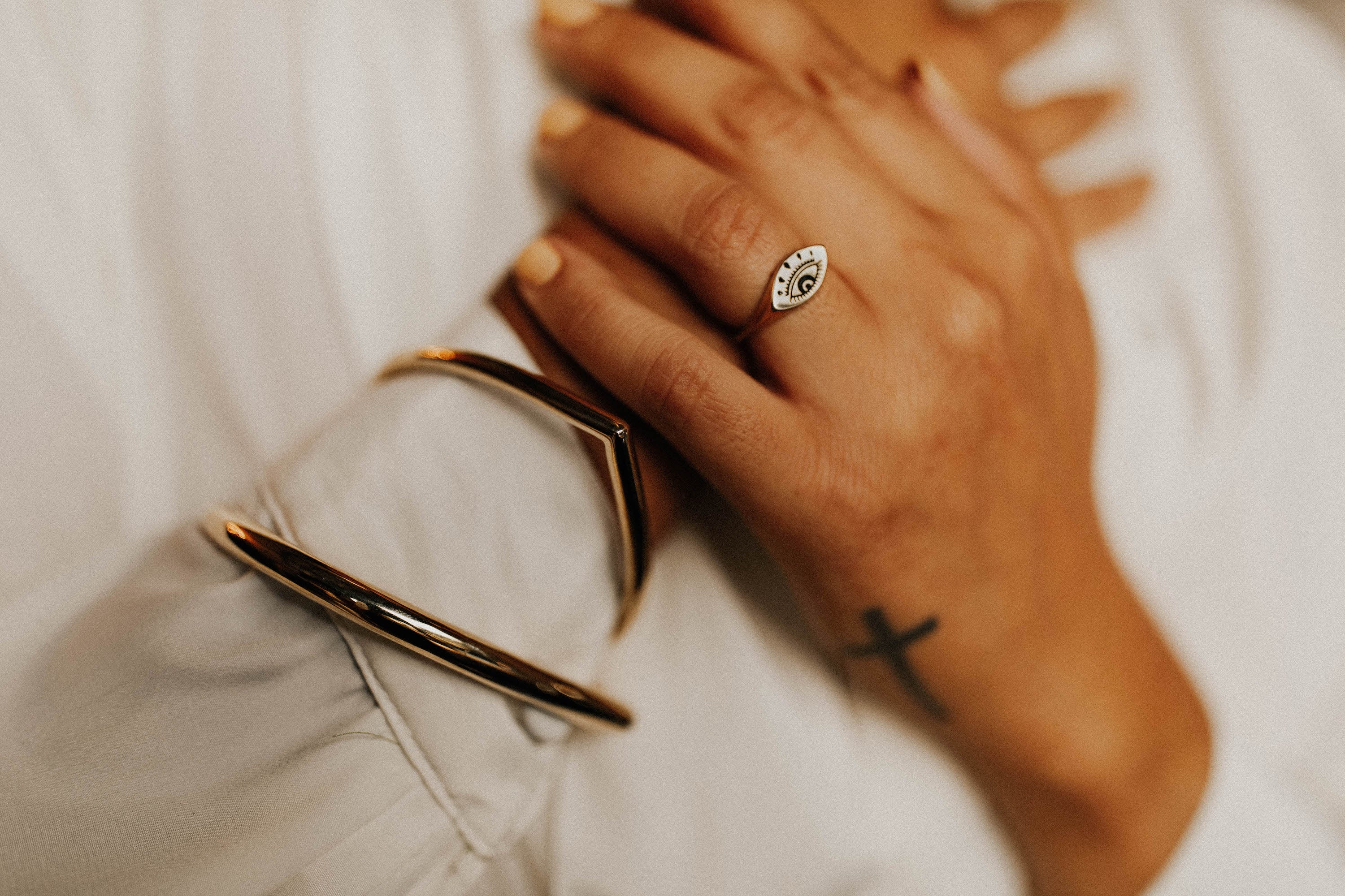 model showcasing 925 sterling silver evil eye ring
