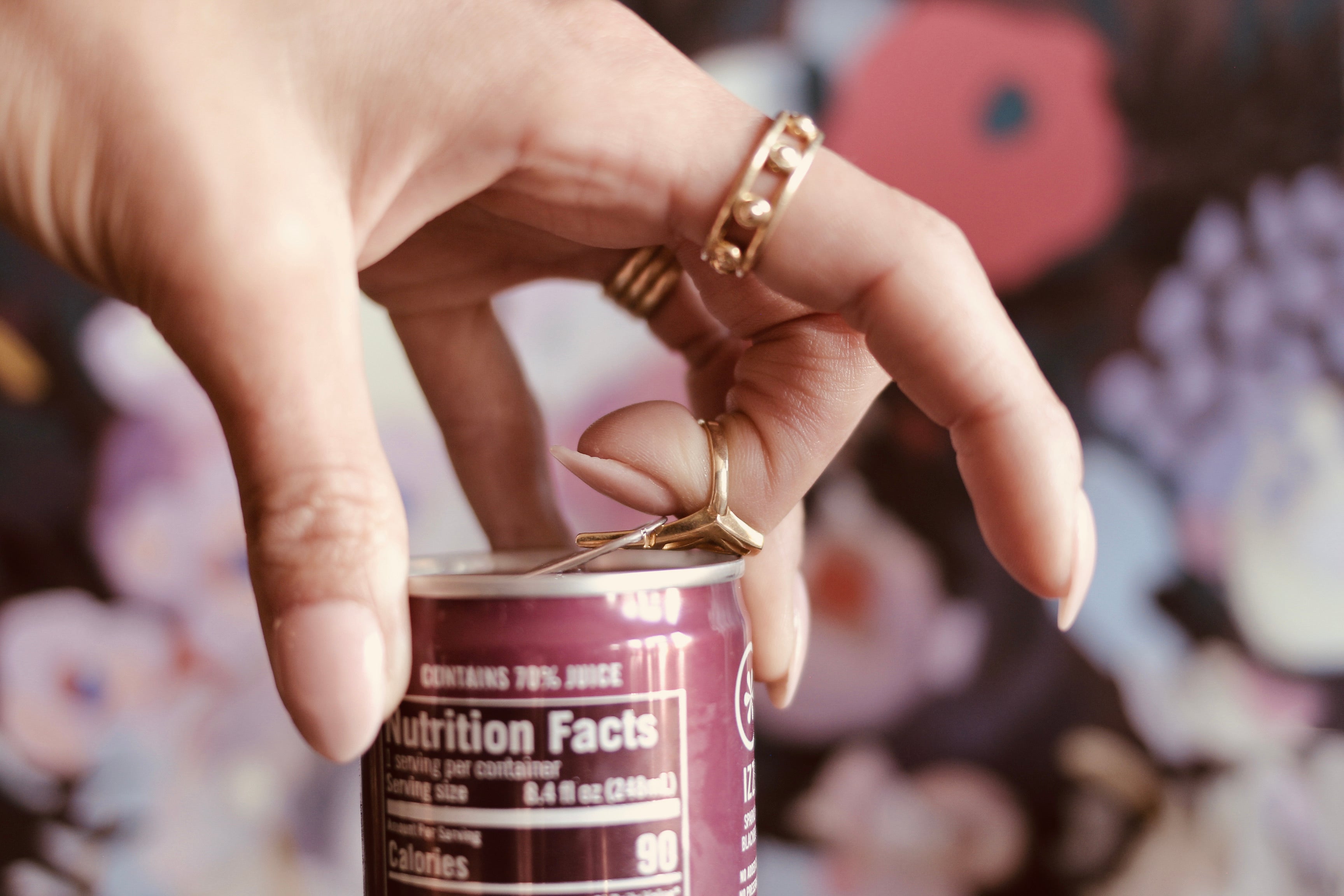 Close up of brass midi ring opening a can top