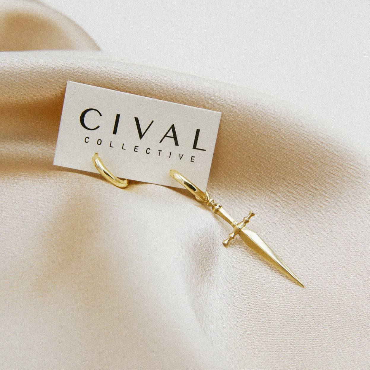 Marceline brass hoops, sword on one hoop