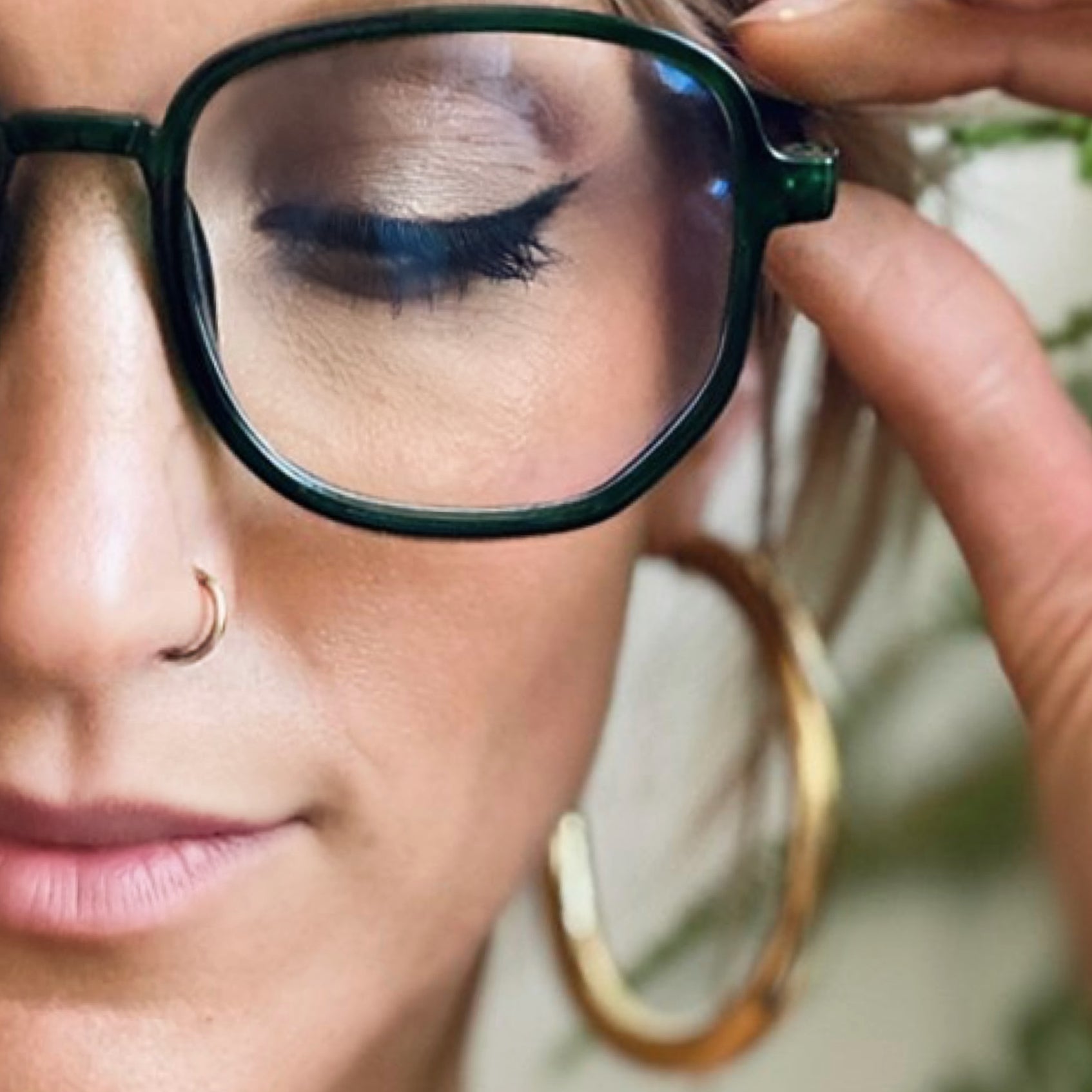 gold nose ring on model