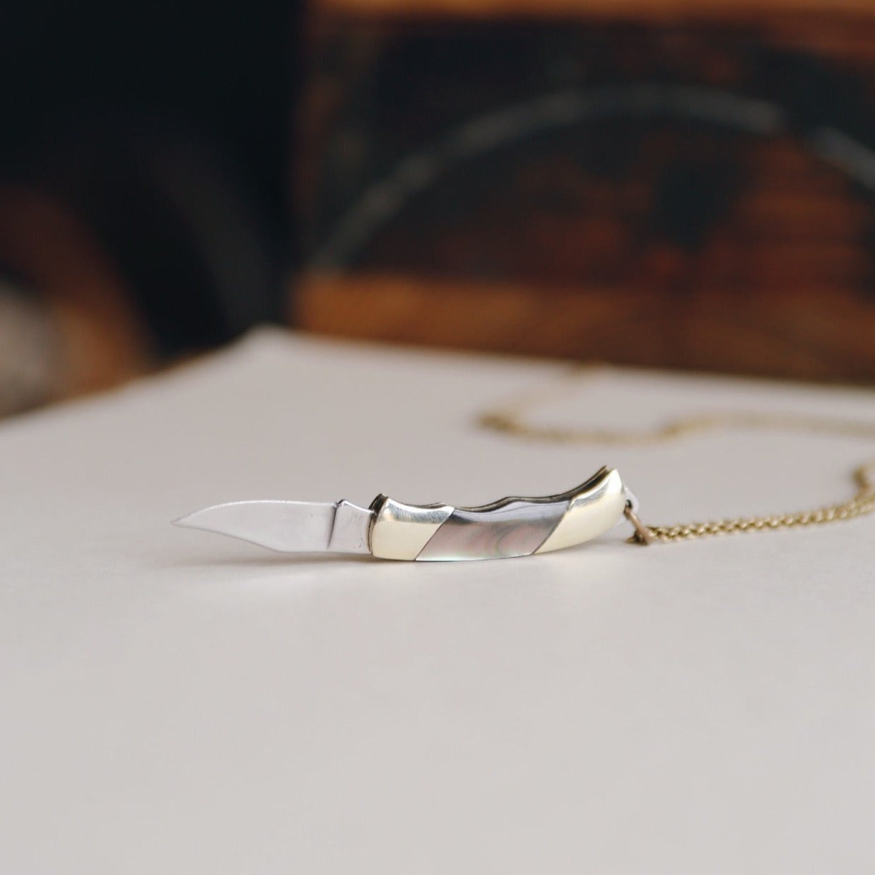 real pocket knife pendant on gold fill chain, blade extended out