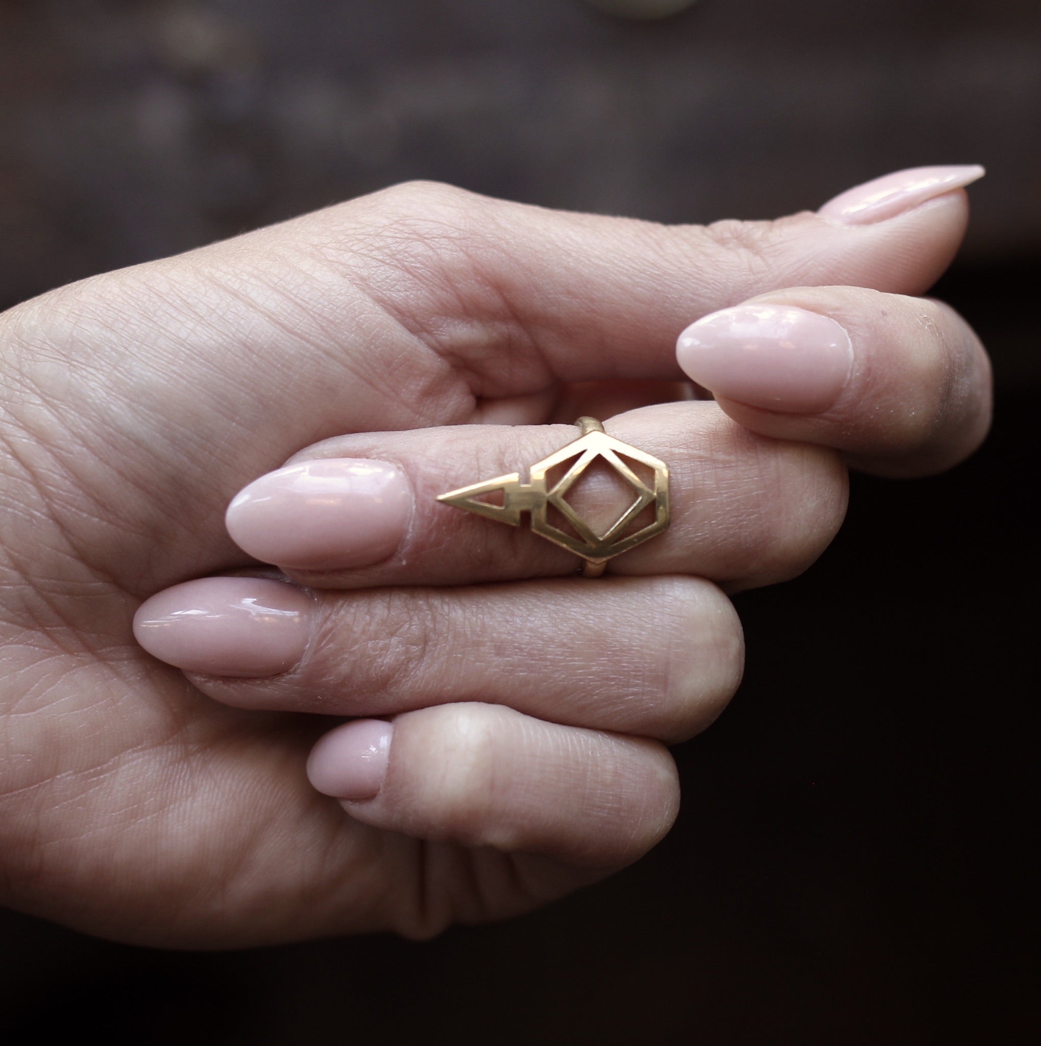 close up of brass Nina midi ring on model, cute and used to open cans and not break your nails. made by cival collective in Milwaukee Wisconsin