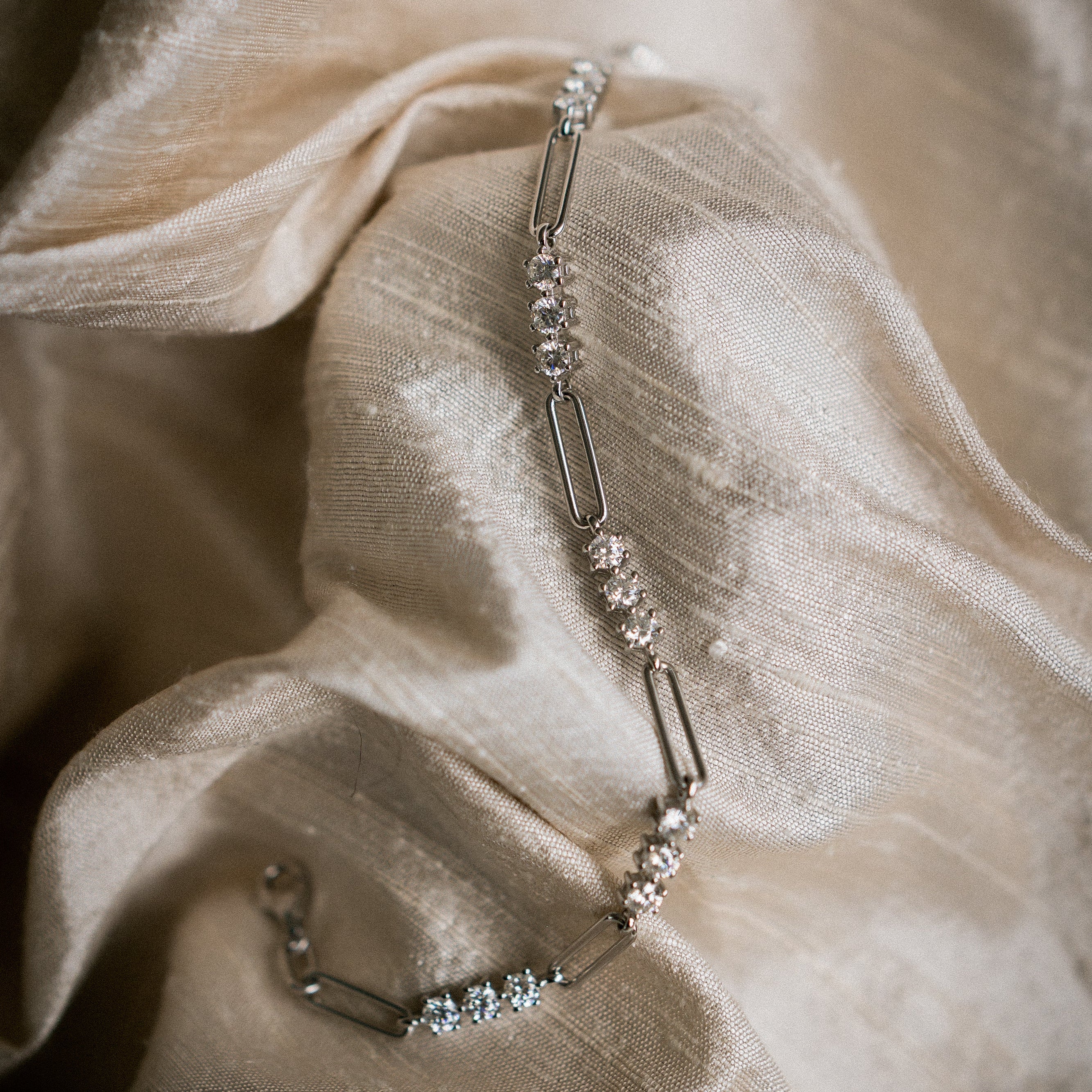 Moissanite paperclip tennis bracelet, white gold filled sold by Cival in BayView Milwaukee Wisconsin. Perfect for a demi fine gift. 
