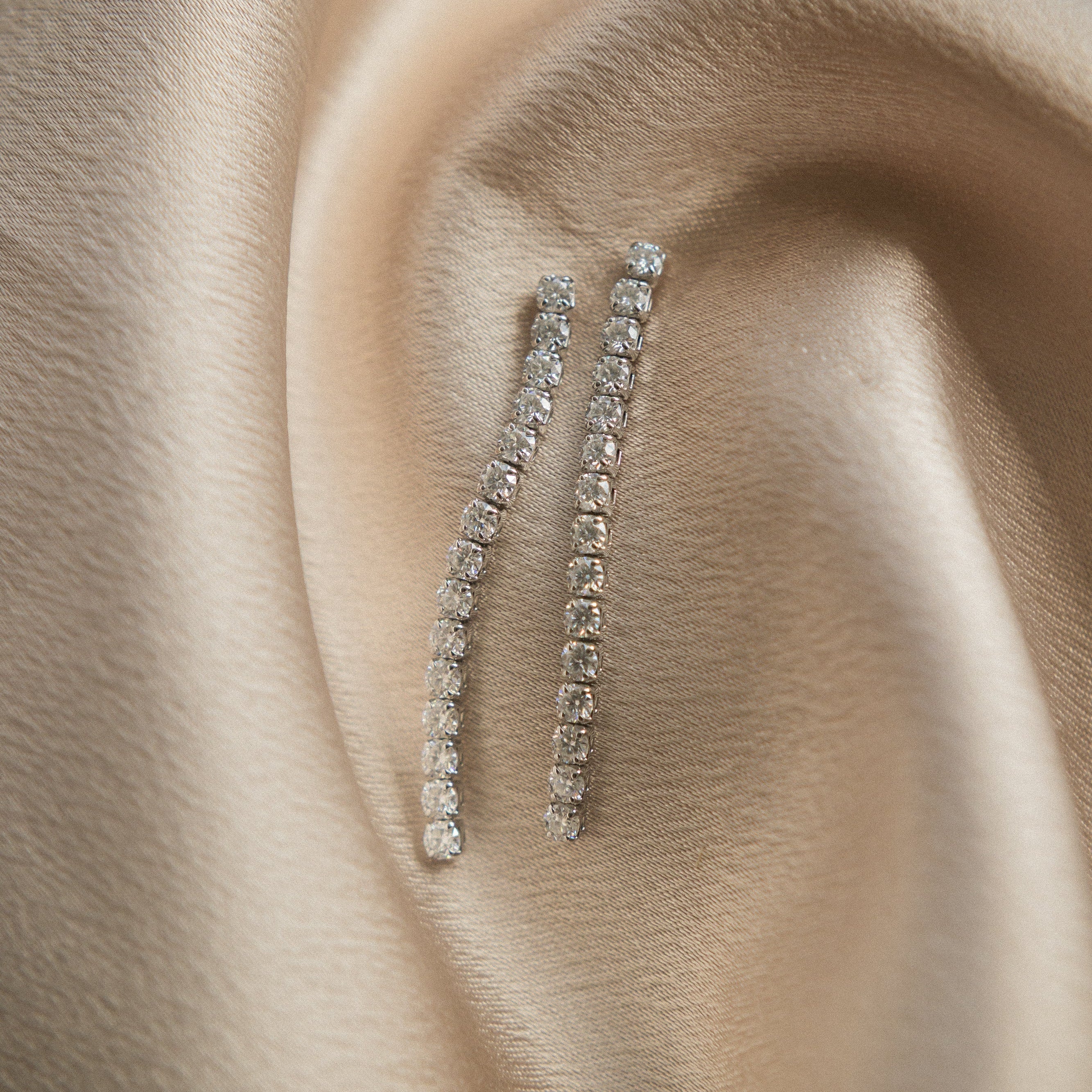 Moissanite demi fine white gold filled post earrings in a tassle like manor. Perfect gift or everyday wear. Sold by Cival in bayview milwaukee wisconsin