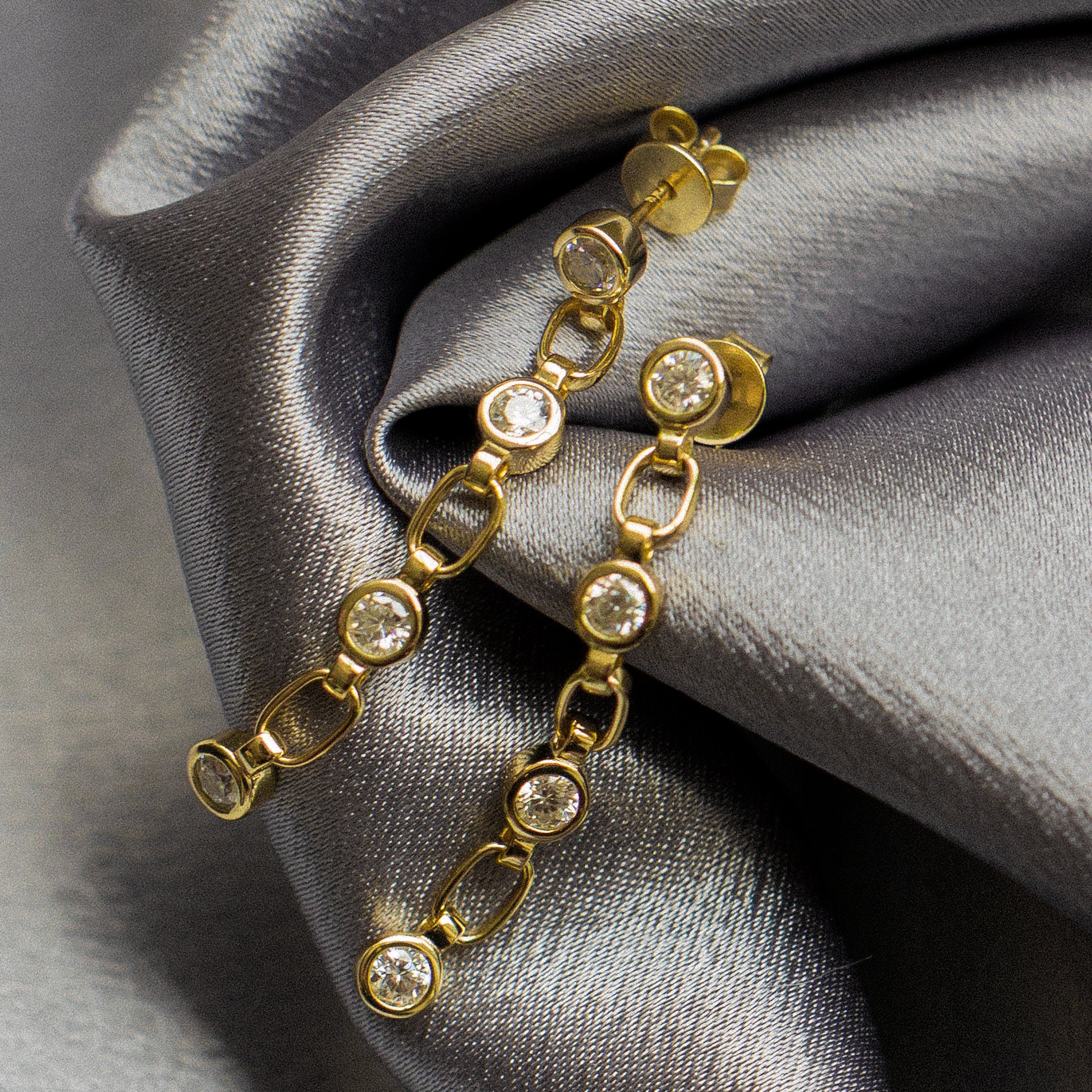 Yellow gold vermeil post earings with paperclip chain and bezel set moissanites. Perfect demi-fine gift or everyday wear. Sold by Cival in Milwaukees Bayview. 