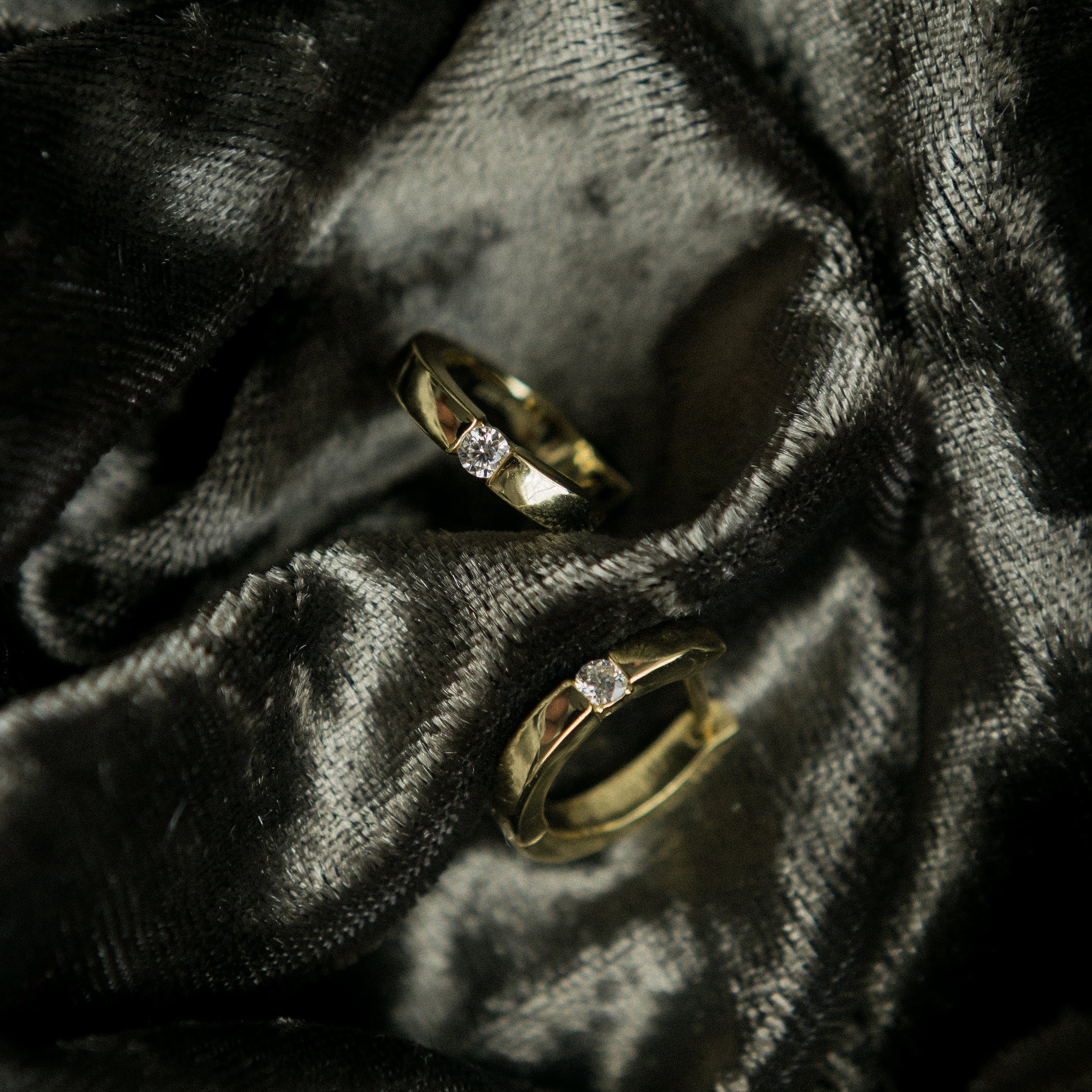 Yellow gold vermeil huggie hoops with a simple moissanite. Perfect for a demi fine gift or everyday wear. Sold by Cival in Milwaukees Bayview. 