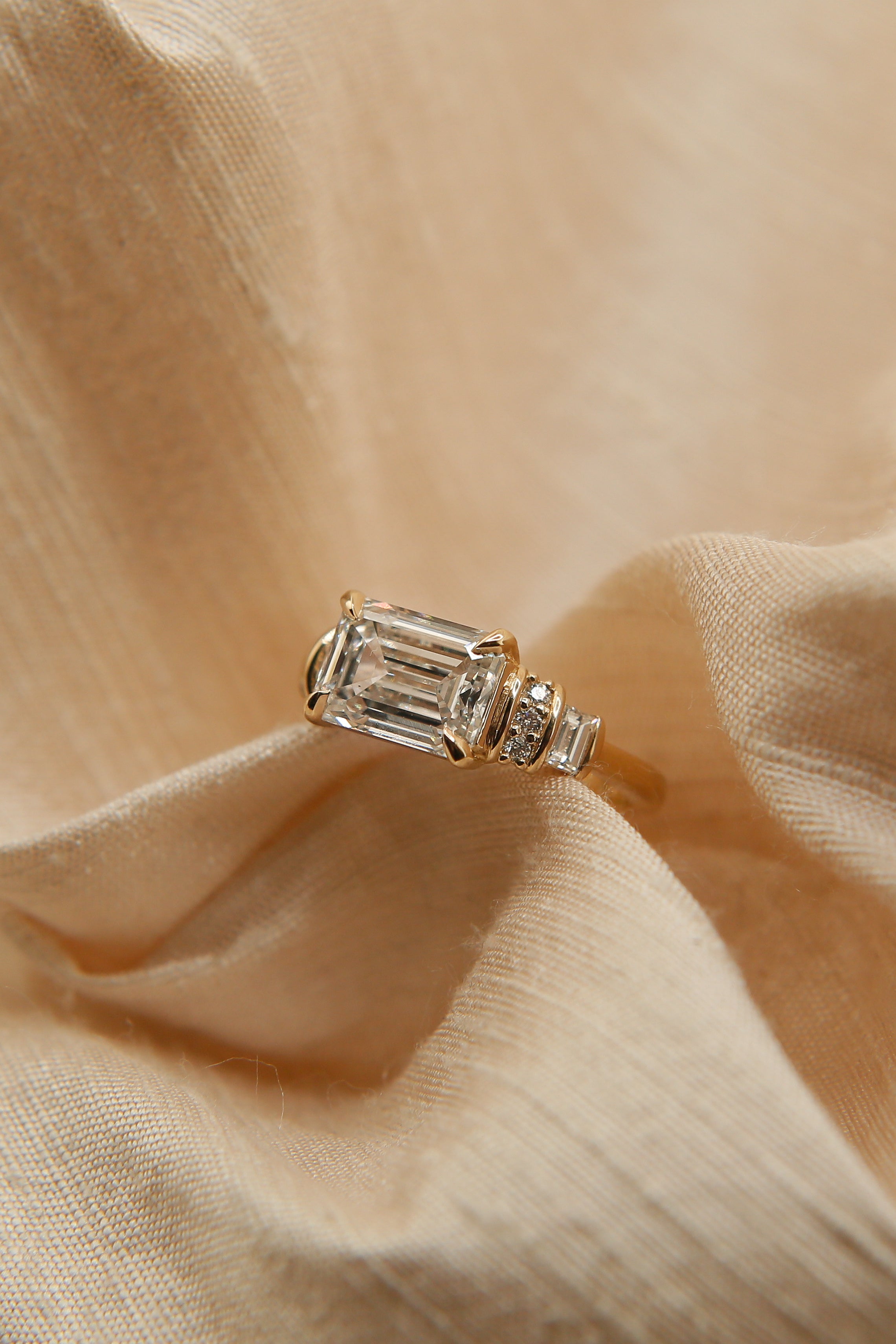 handmade art deco emerald cut east west set diamond engagement ring 