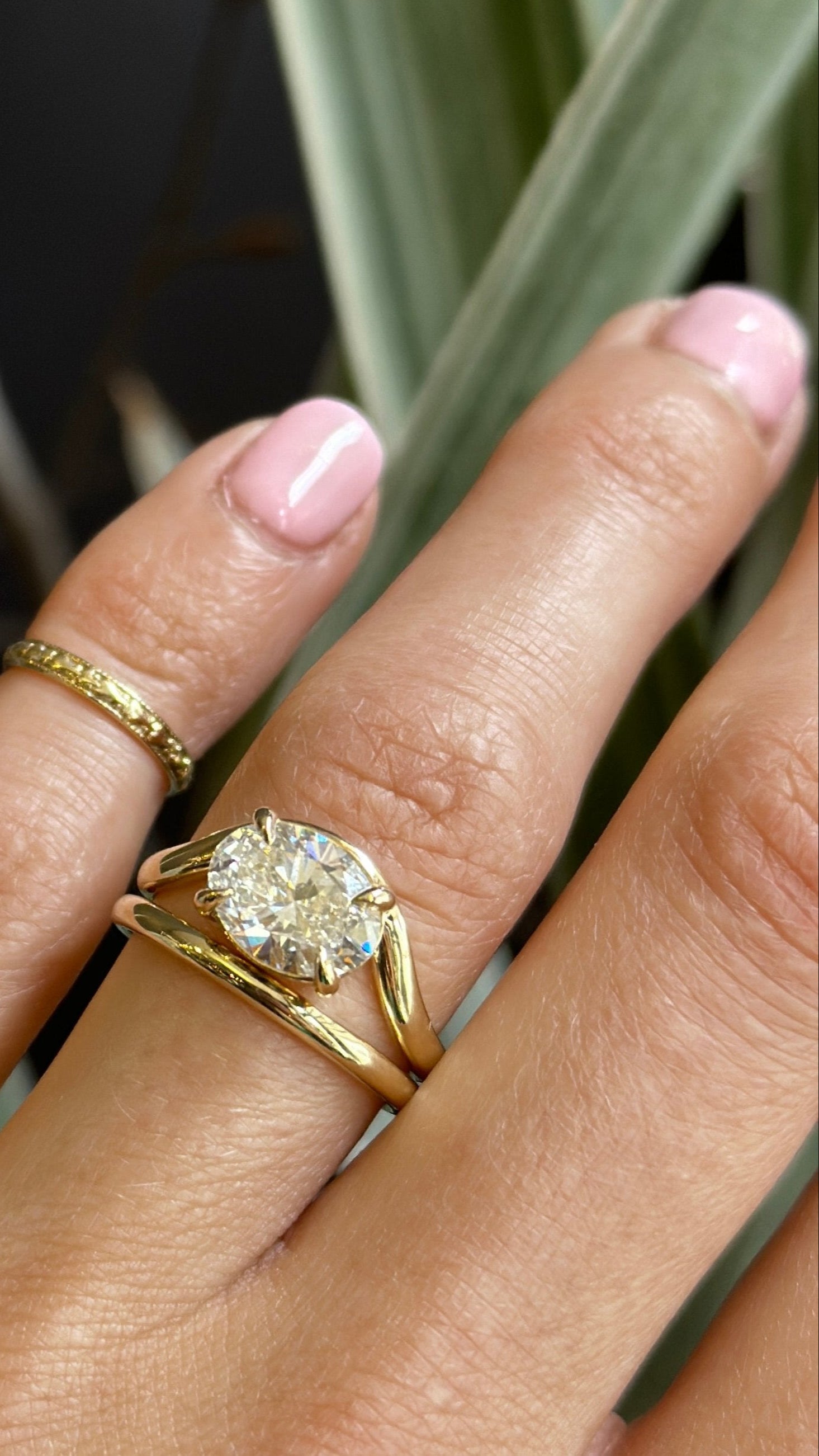 14k yellow gold Oval Diamond Engagement ring with wavy band. Customize this unique ring with your choice of stone type, stone shape and stone size. Diamond, moissanite, round, oval, princess, cushion, asscher, marquise. Cival in Milwaukee Wisconsin. 