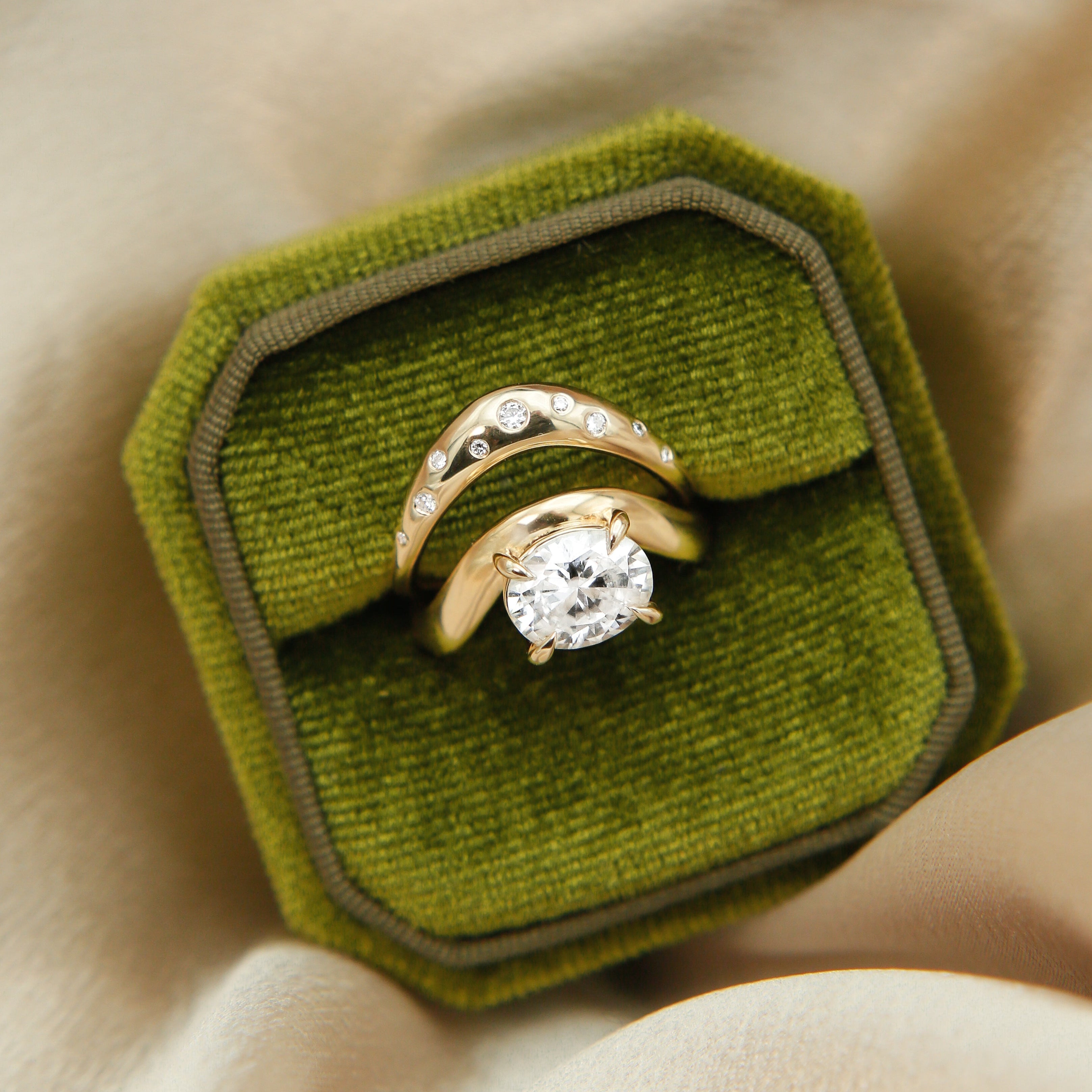 Hydra wave band in 14k yellow gold with a beautiful oval diamond and 4 claw prongs perfect for an engagement or wedding
