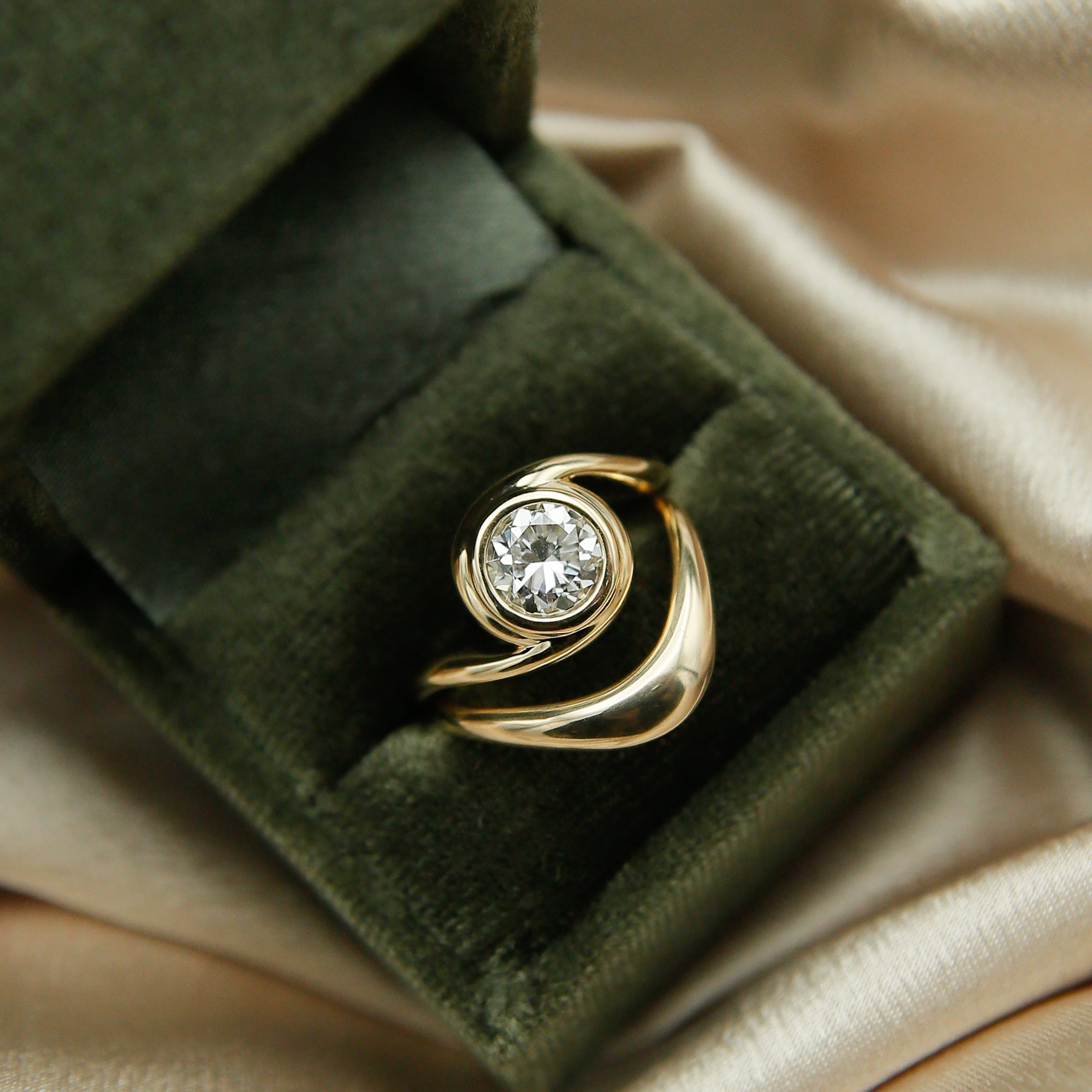 Bypass wedding ring with bezel set stone. Customize this unique ring with your choice of stone type, stone shape and stone size. Diamond, moissanite, round, oval, princess, cushion, asscher, marquise. Cival in Milwaukee Wisconsin. 