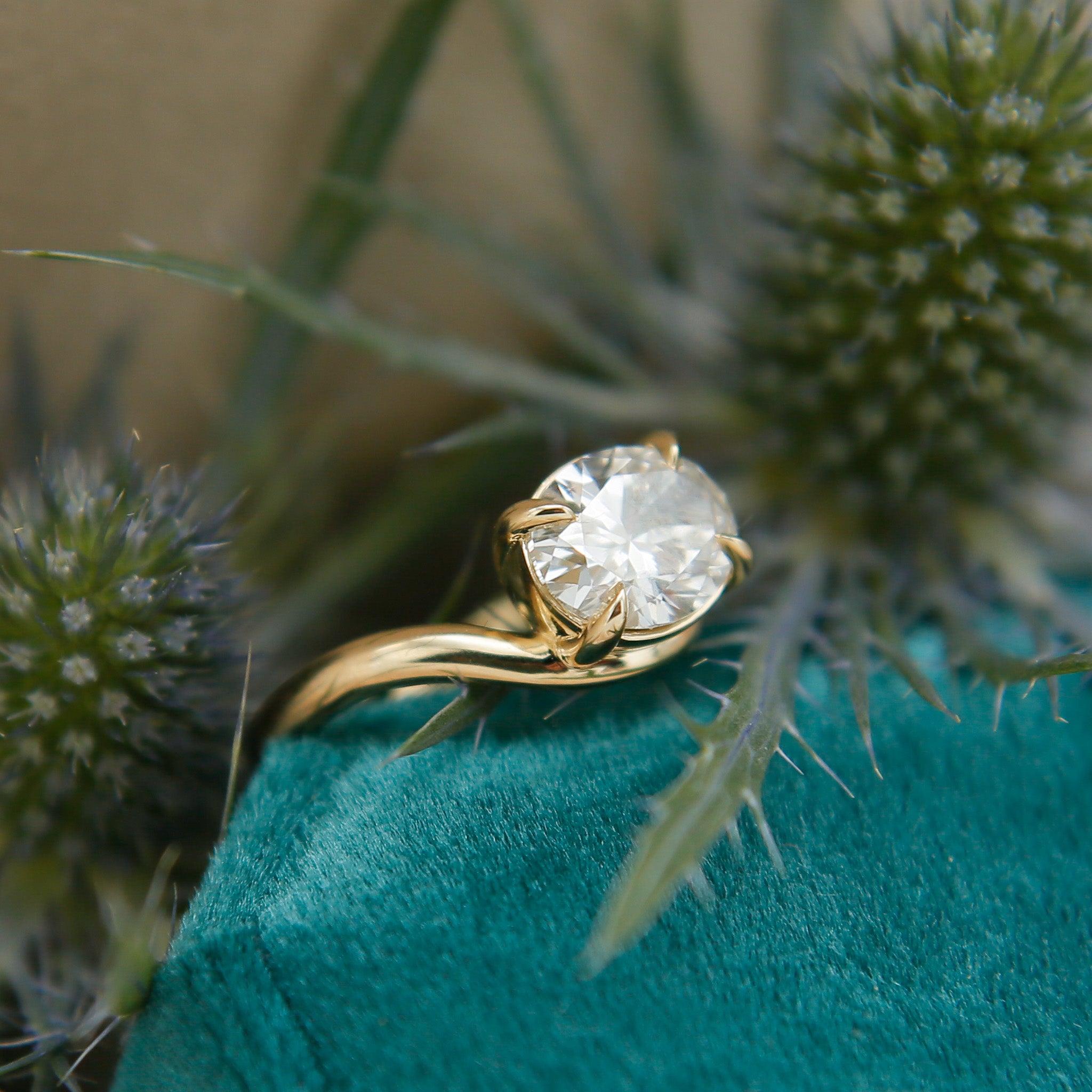 Engagement ring in 14k gold, wave style with four claw prongs. Customize this unique ring with your choice of stone type, stone shape and stone size. Diamond, moissanite, round, oval, princess, cushion, asscher, marquise. Cival in Milwaukee Wisconsin. 