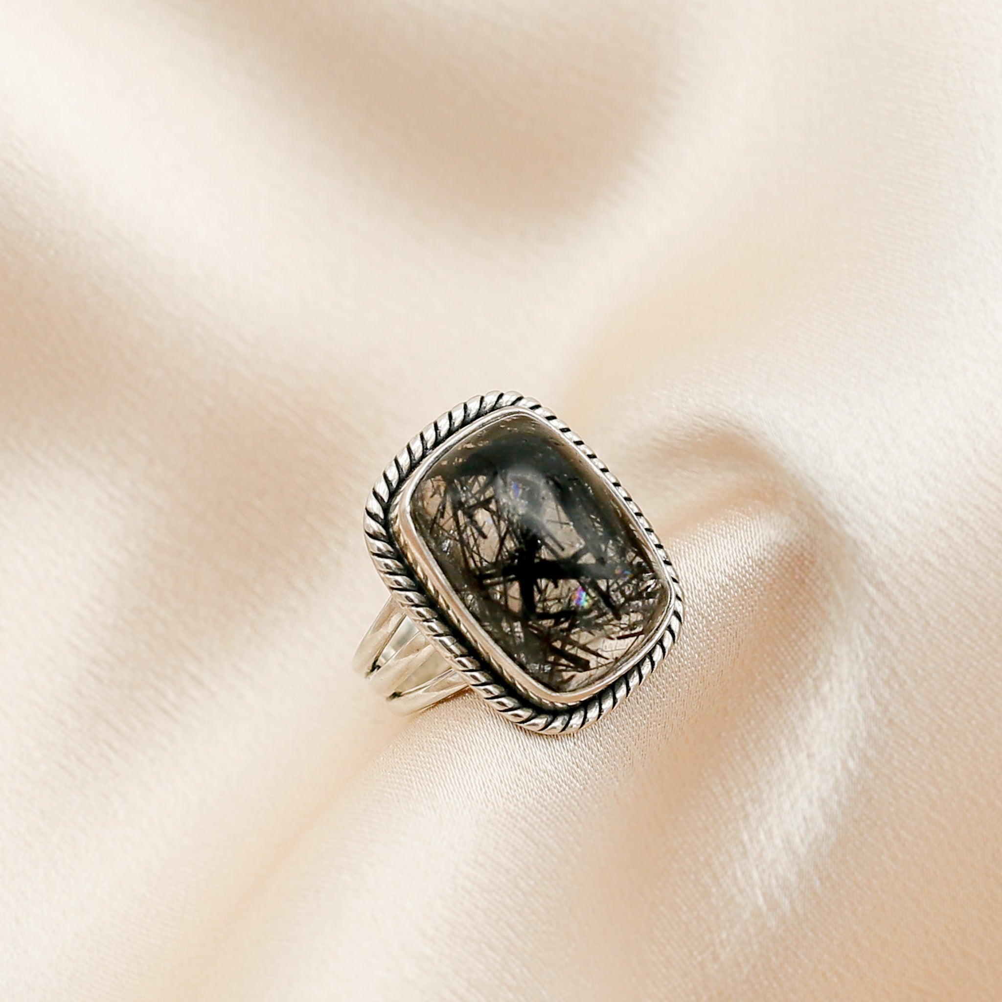 Black tourmaline in clear quartz rectangle ring  side profile sowing silver band