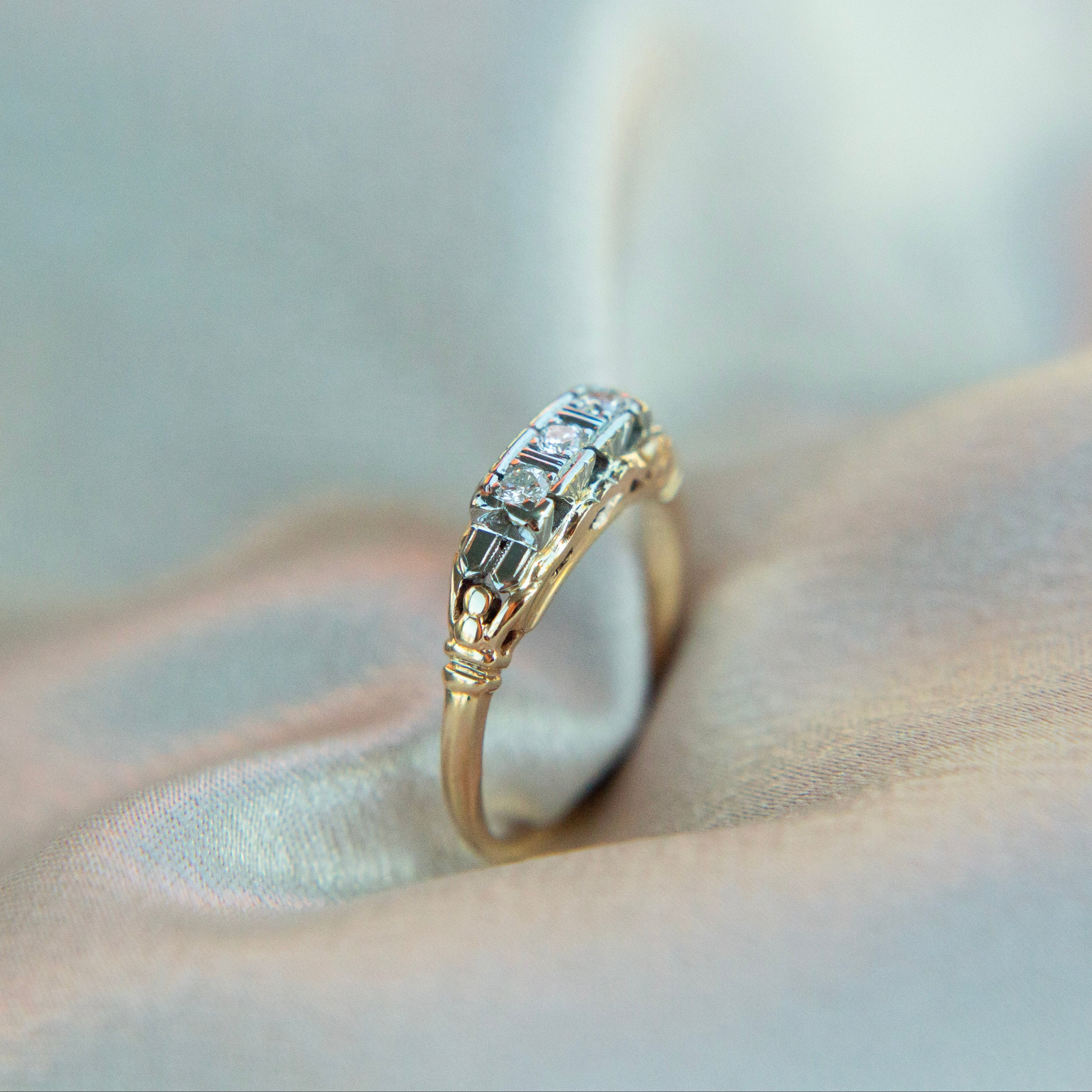 Two tone die struck cast three stone engagement ring | sz 6.5