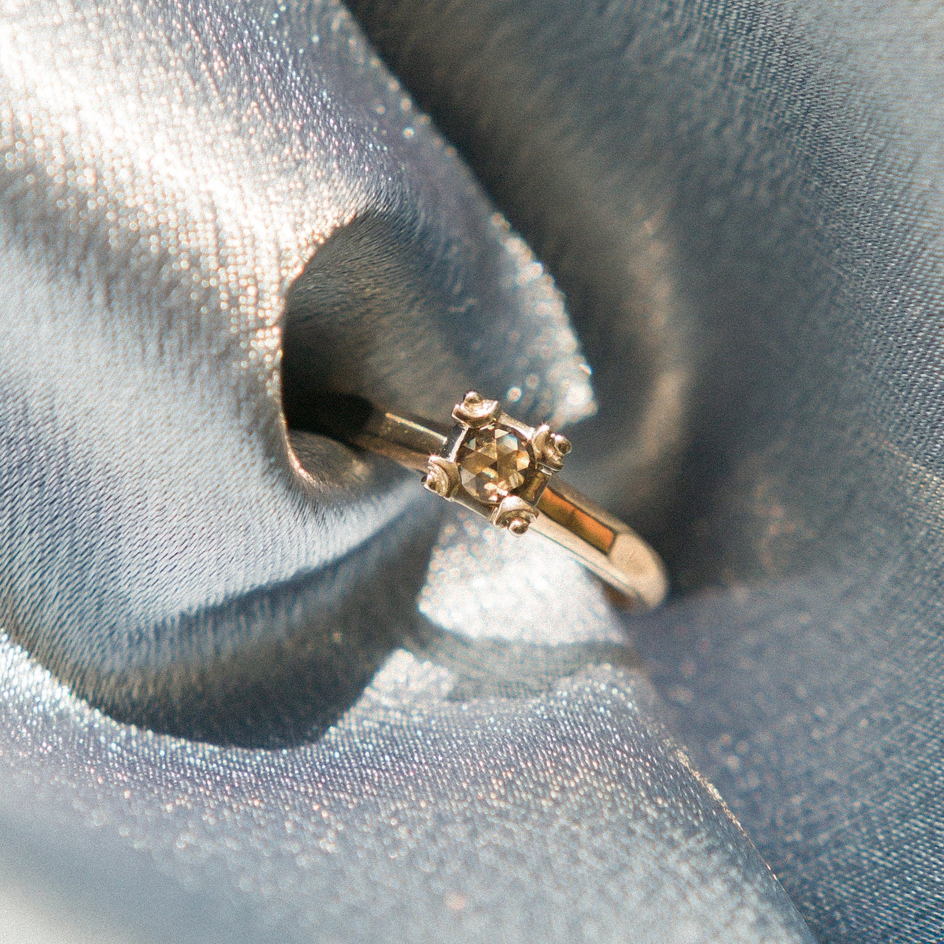 vintage ring on blue fabric