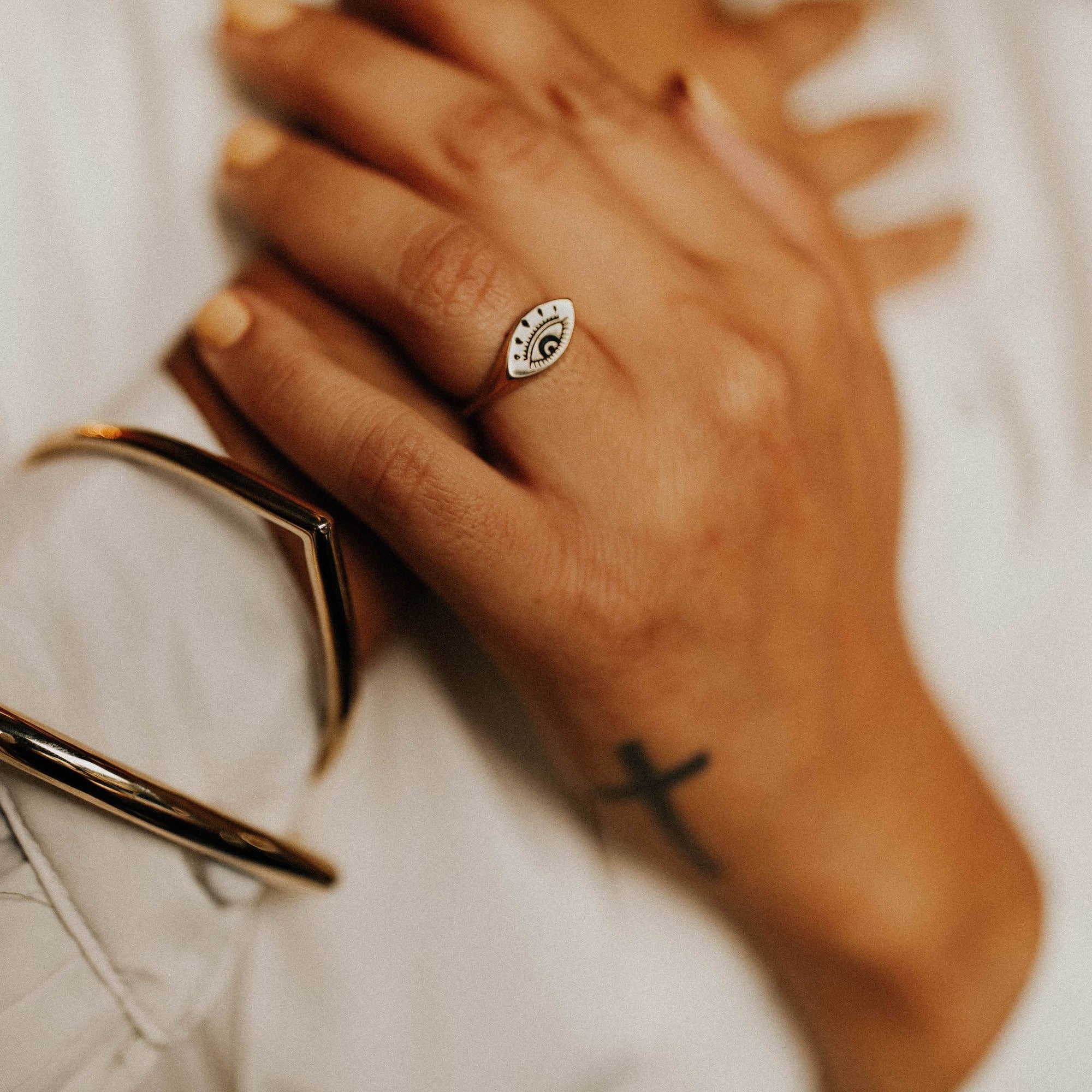model showcasing 925 sterling silver evil eye ring