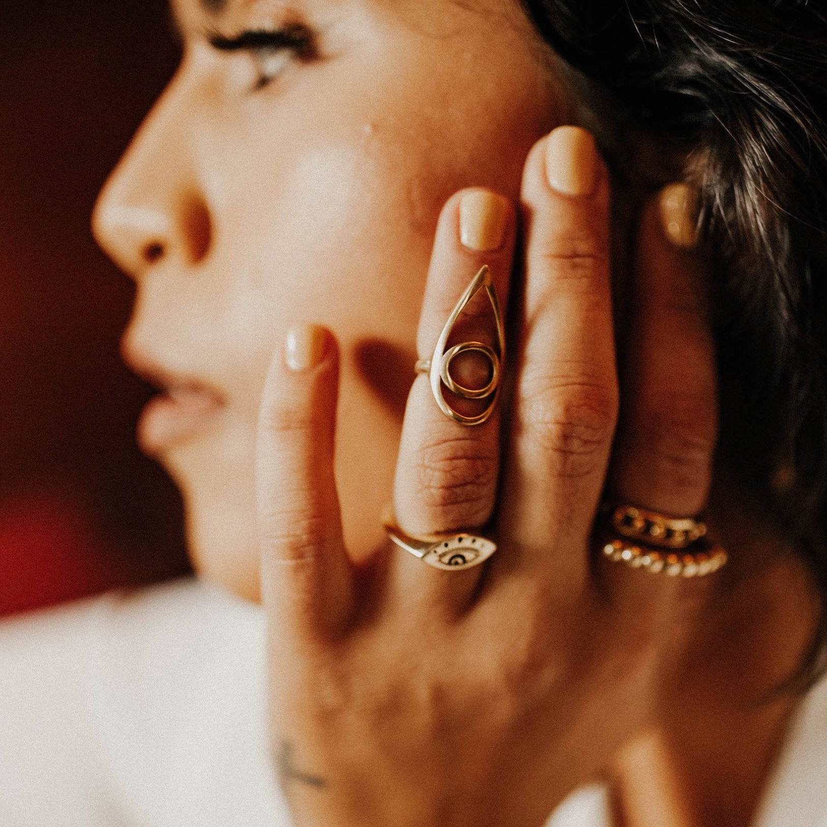 kat midi ring on model,  design by cival collective and cast in brass. the perfect bartender accessory 
