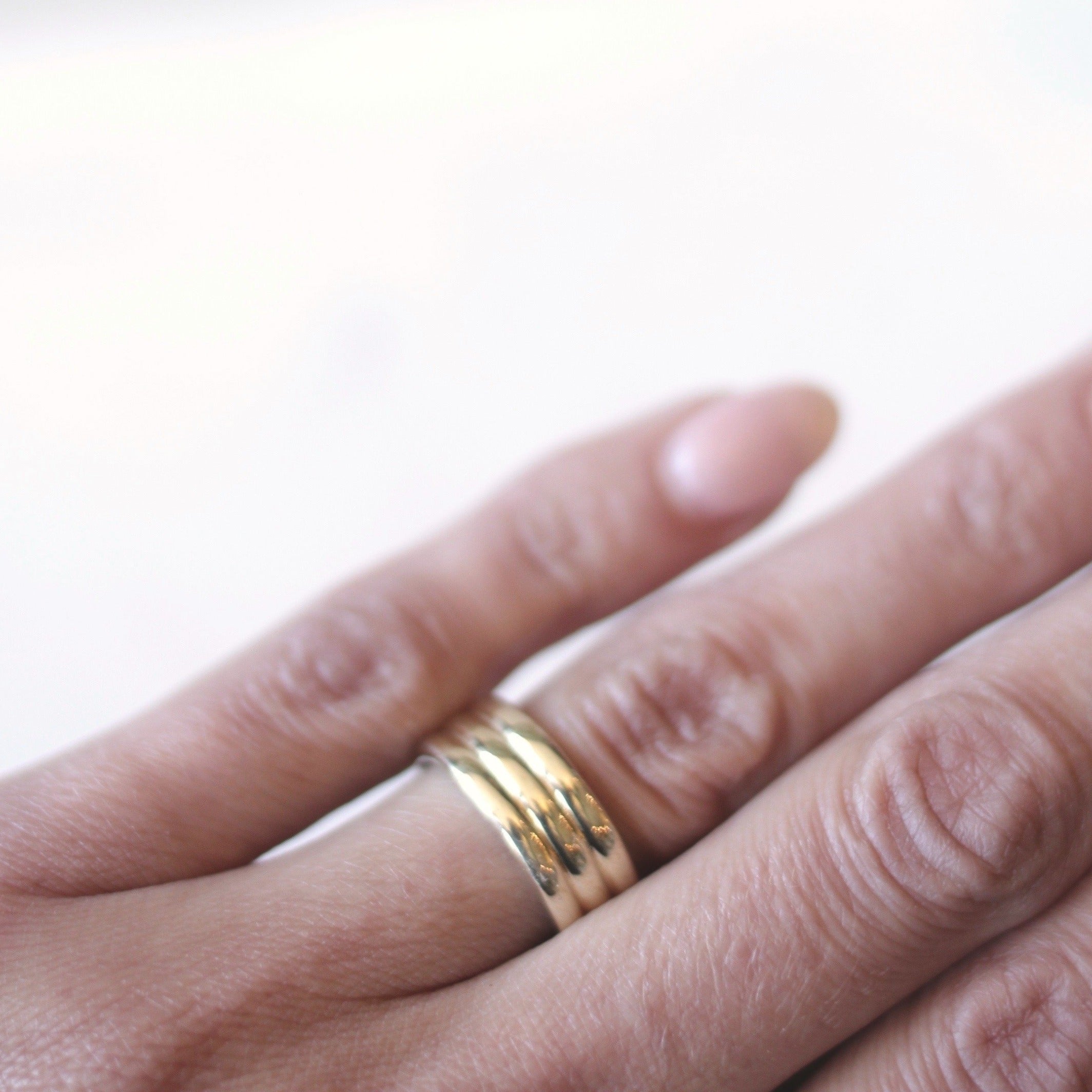brass ella band up close, highlighting the indents