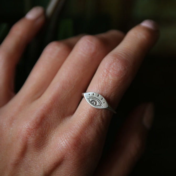 model showcasing sterling silver evil eye ring