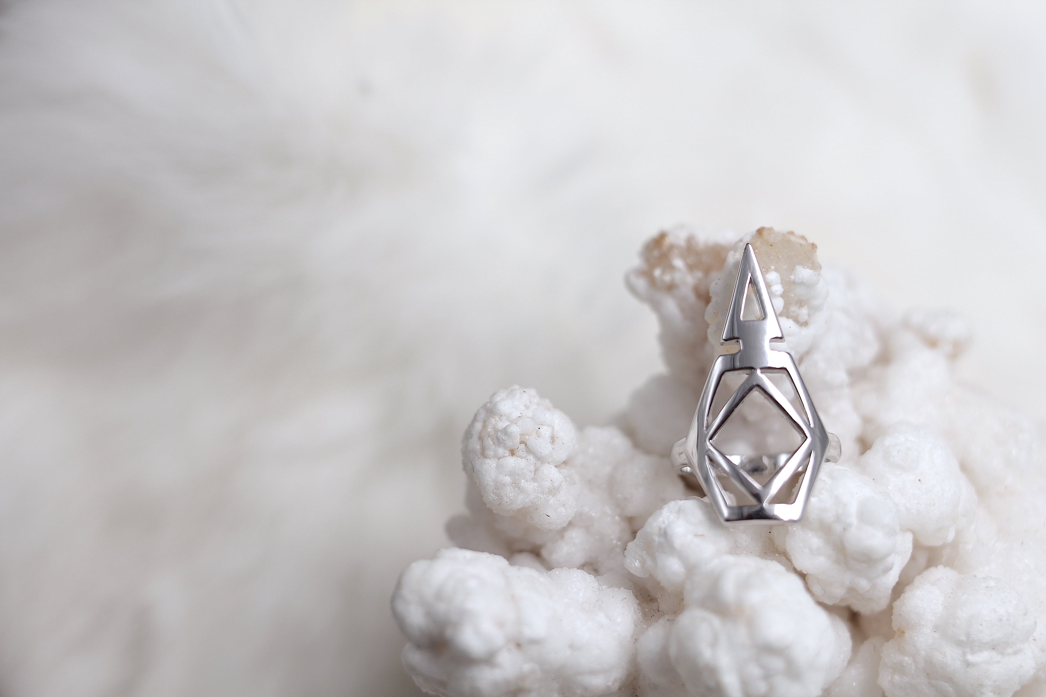 close up of sterling silver midi ring designed to open cans and save your nails